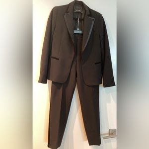 Black tuxedo suit from Zara.